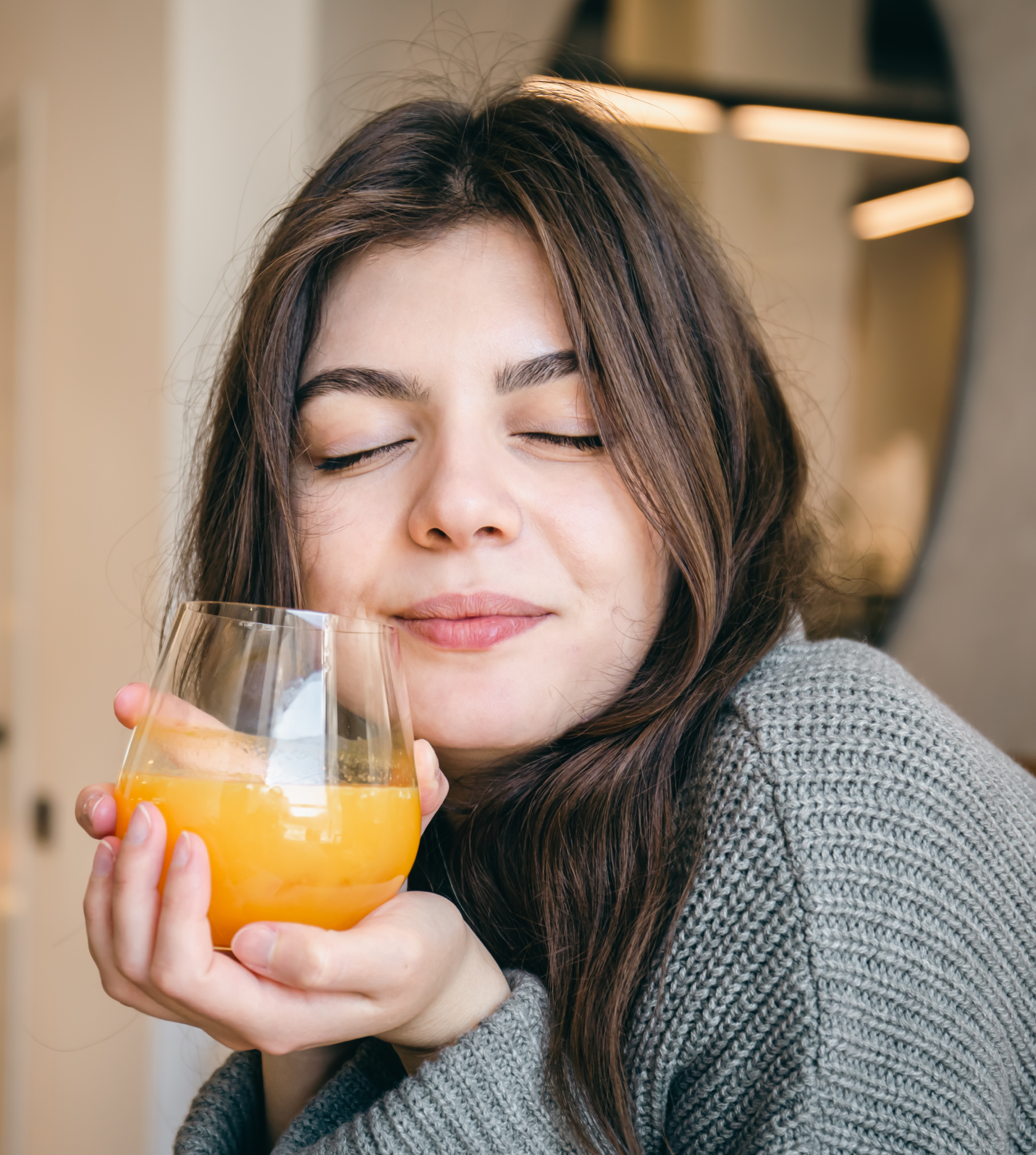 young woman with fresh glass juice